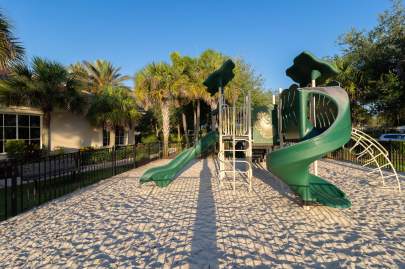 Childrens play area with sand and climbing and sliding equipment